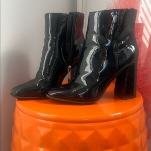 Black Heeled Boots in Patent Leather
